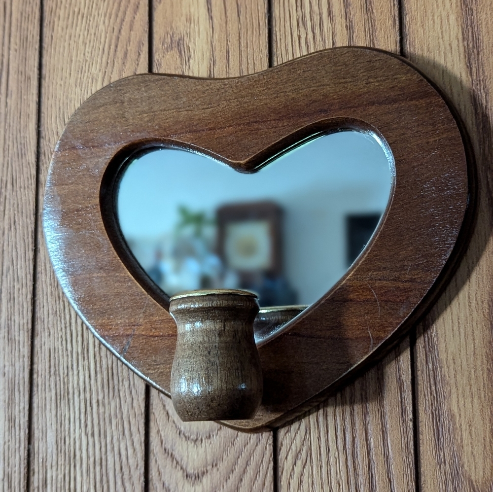 Heart shaped mirror with candle stick holder.‎